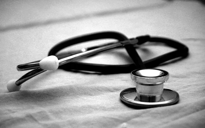 A stethoscope resting on a light fabric surface