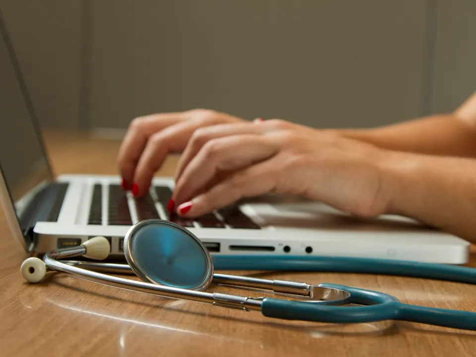A person having a virtual health consultation on a tablet at home